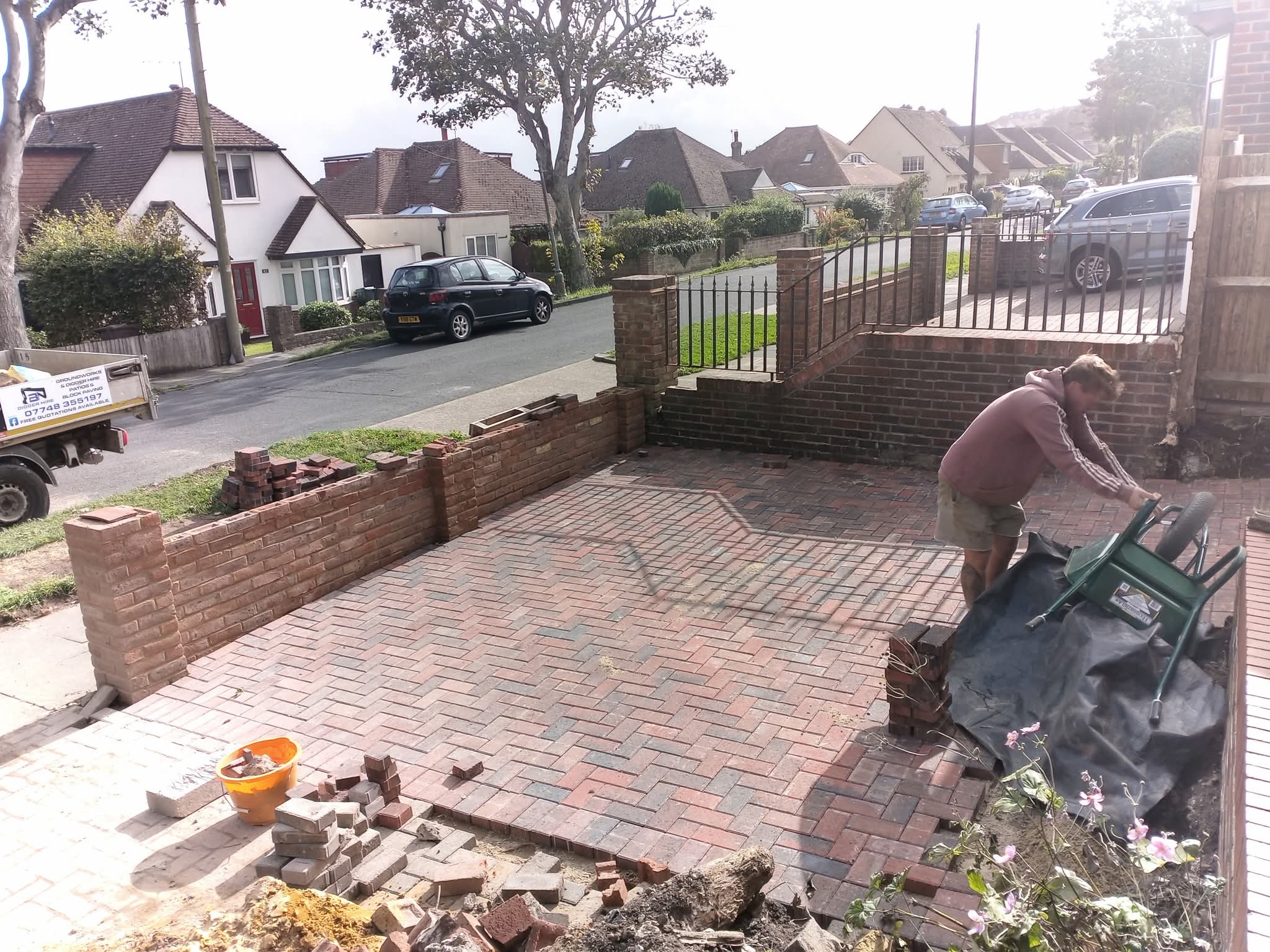 Block-paved driveway with new brick garden wall and railings