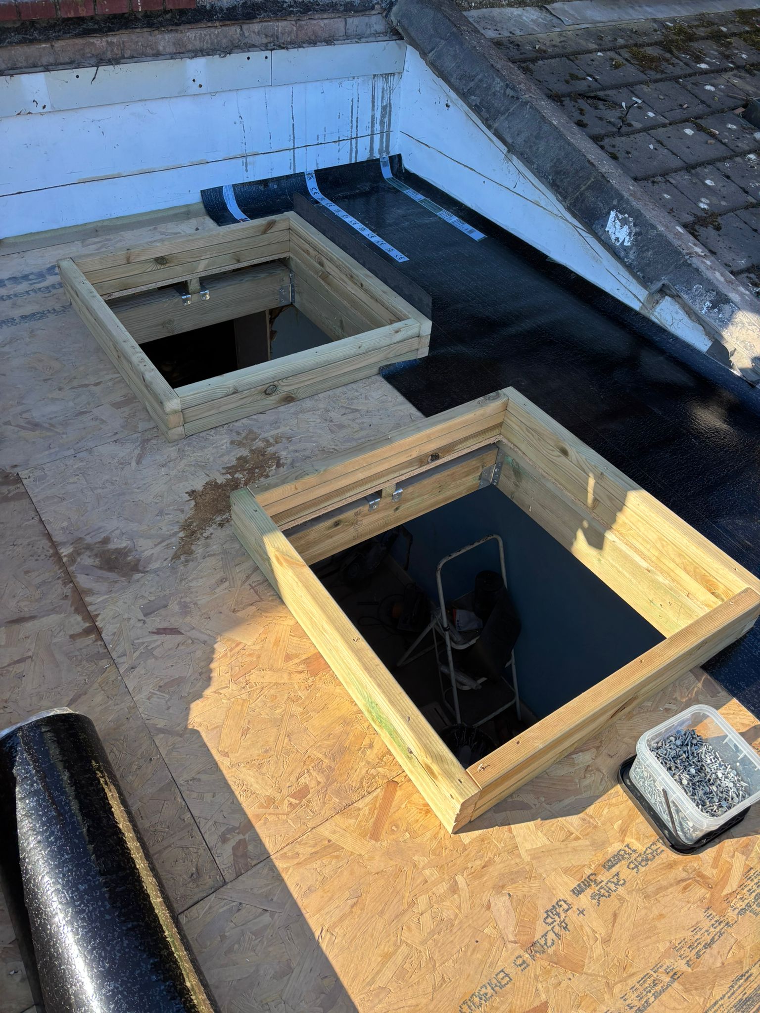 Flat roof build with timber rooflight kerbs on a new deck