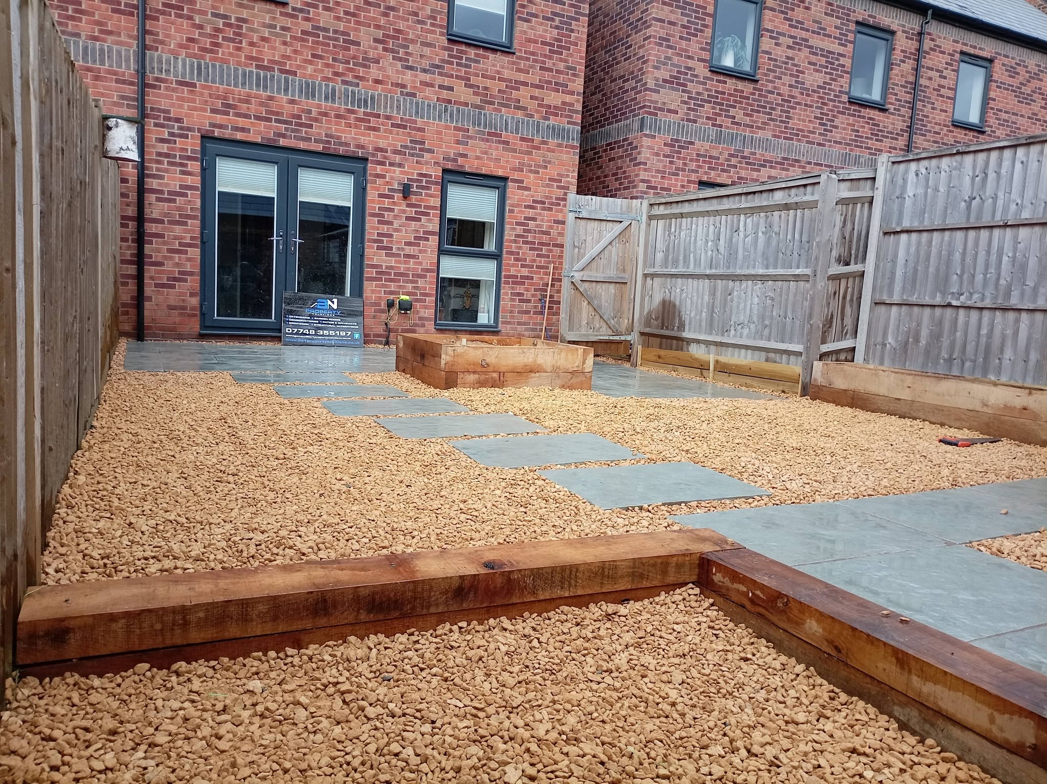 Landscaped garden with slate paving and gravel