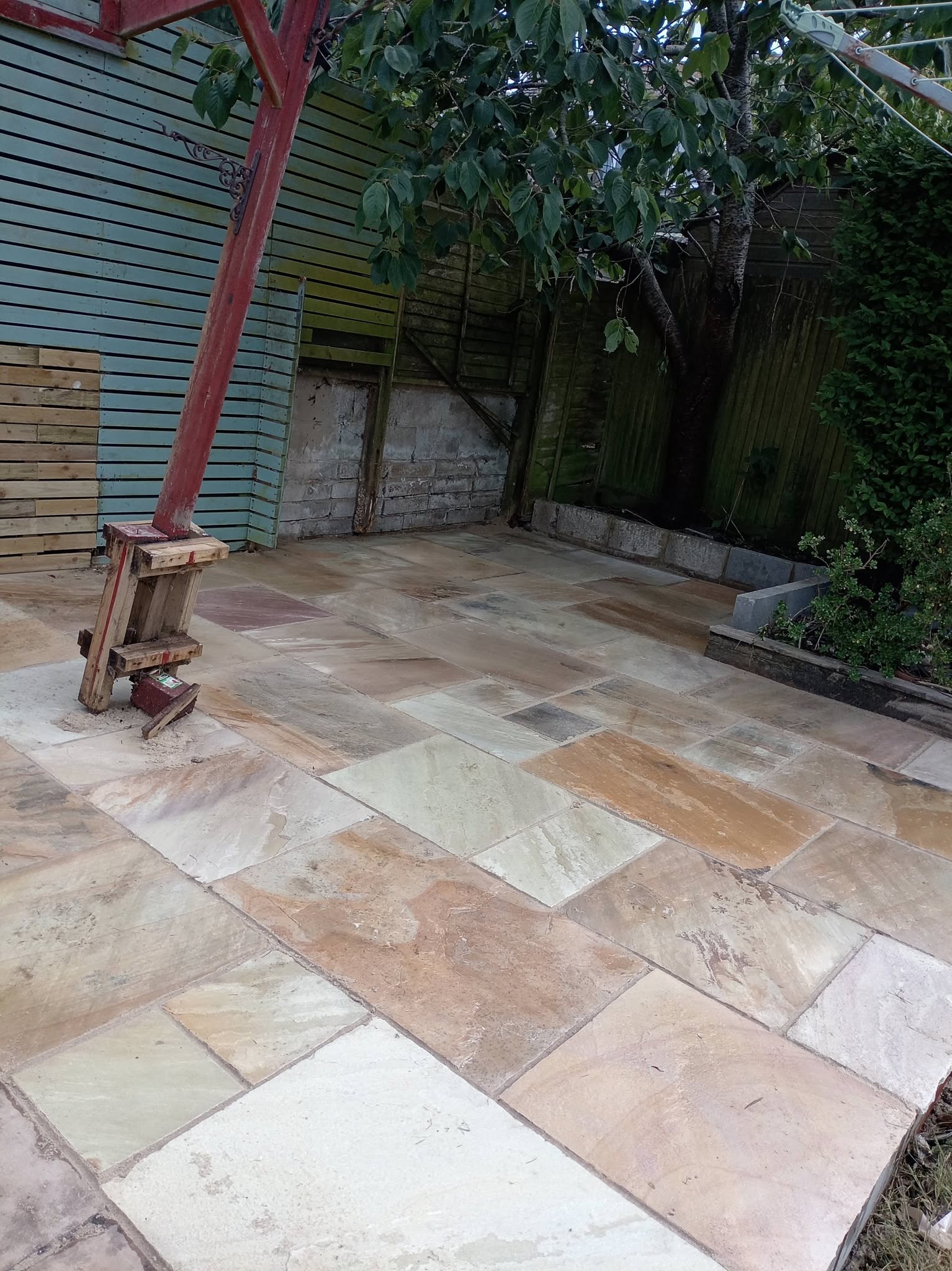 Buff sandstone paving in a rear garden