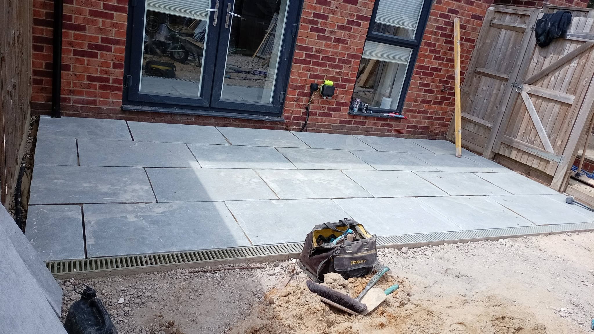 Grey porcelain patio with bi-fold doors